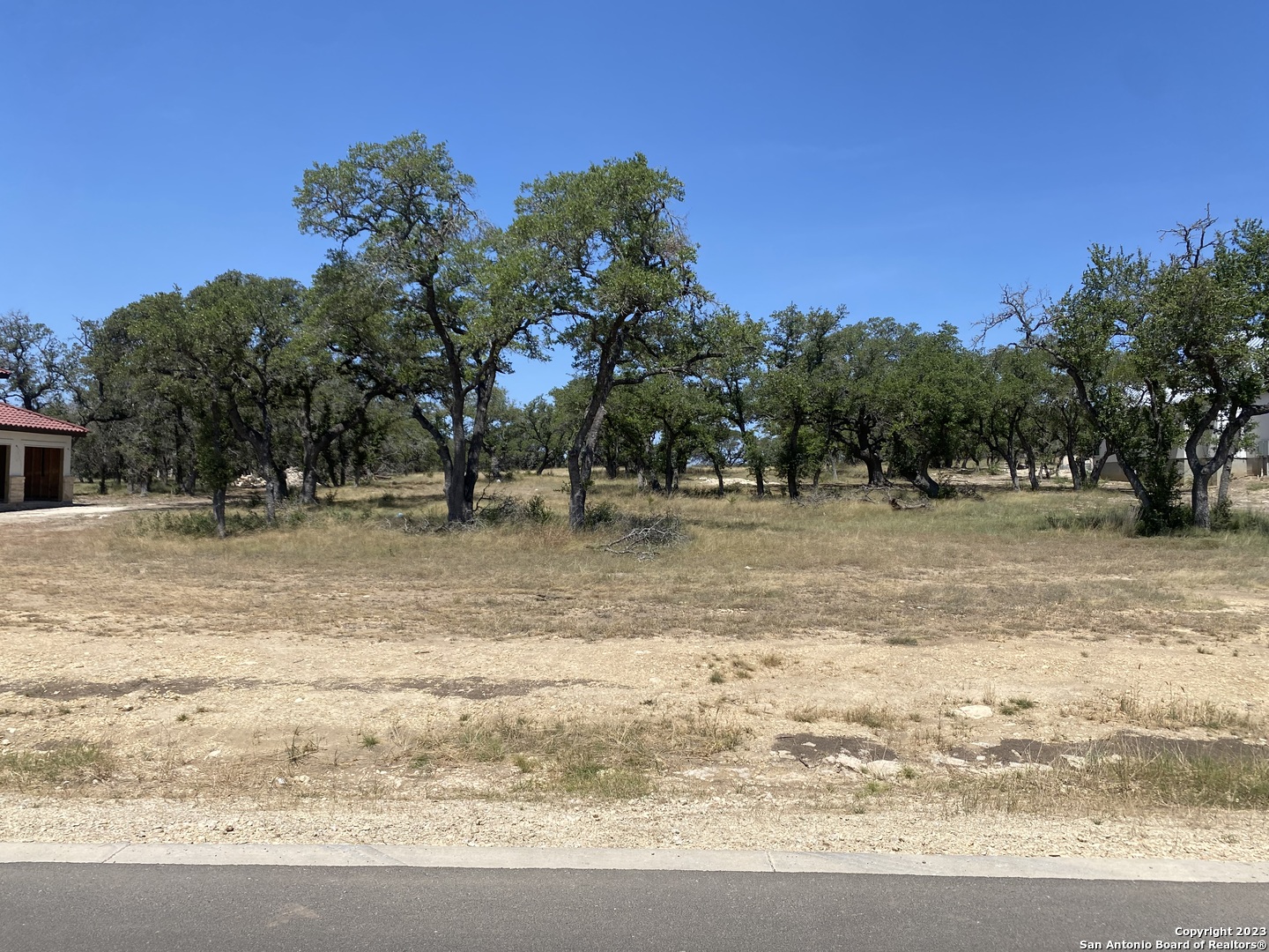 930 Maximino Ridge Rd. Bulverde, TX 78163 - Photo 3 of 18 a view of road with trees