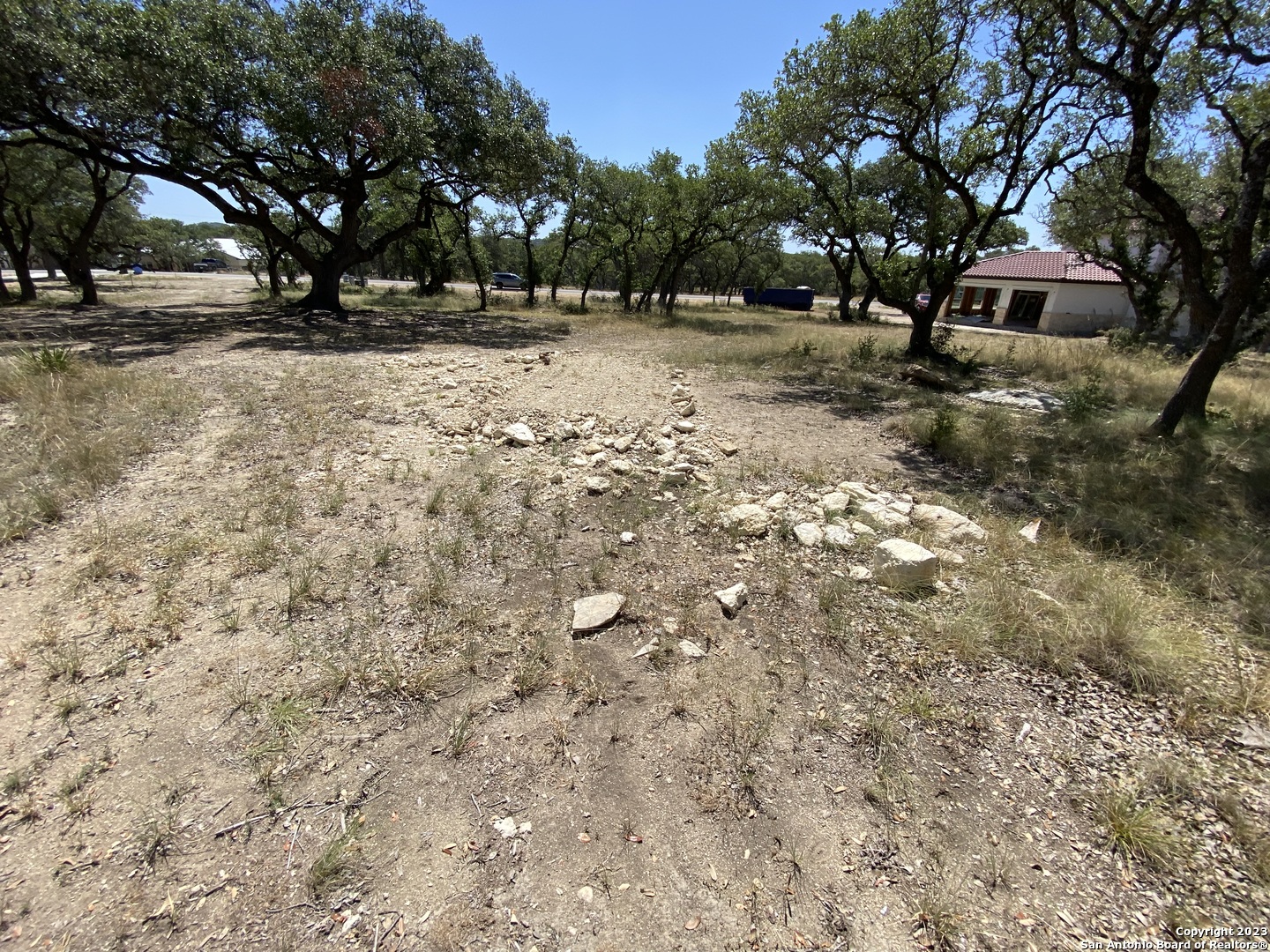930 Maximino Ridge Rd. Bulverde, TX 78163 - Photo 9 of 18 a view of a yard with plants and trees