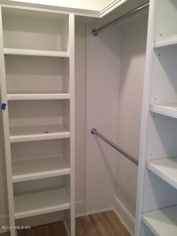 4 Gregory Road Cos Cob, CT 06807 - Photo 11 of 15 a view of walk in closet with empty racks