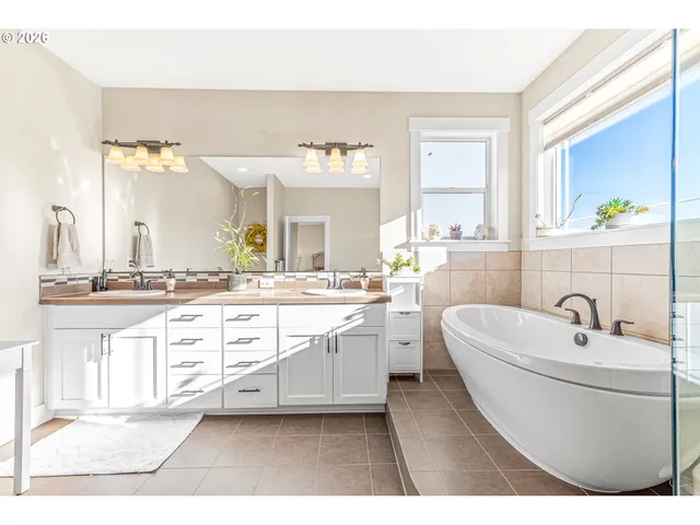 a bathroom with a sink a bathtub and a shower