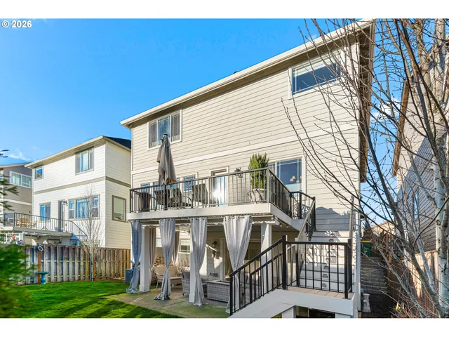a view of a house with a yard and sitting area