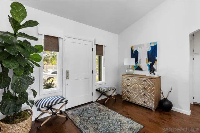 a bedroom with furniture and a window