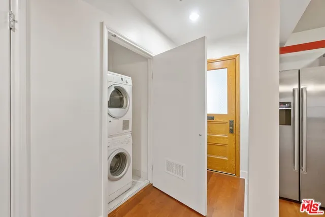 a view of a room with wooden floor