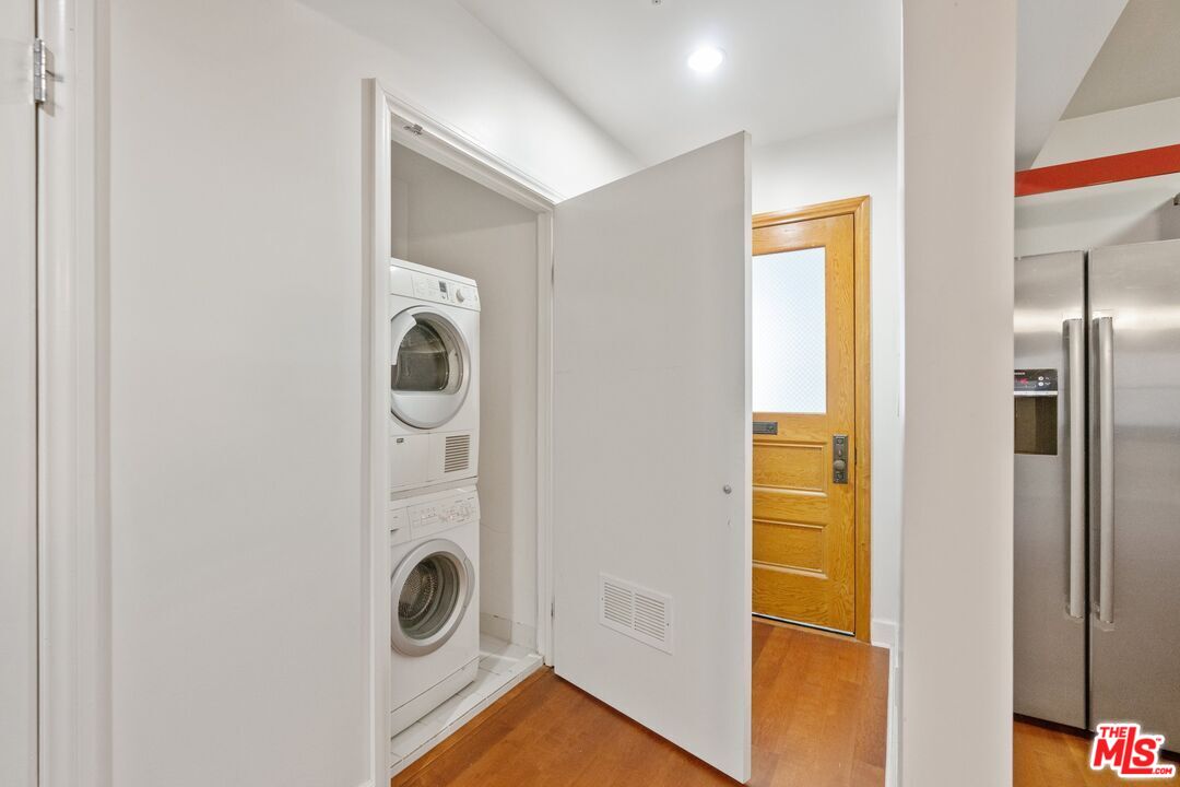 416 South Spring Street, Unit 210 Los Angeles, CA 90013 - Photo 12 of 18 a bathroom with a sink and a mirror