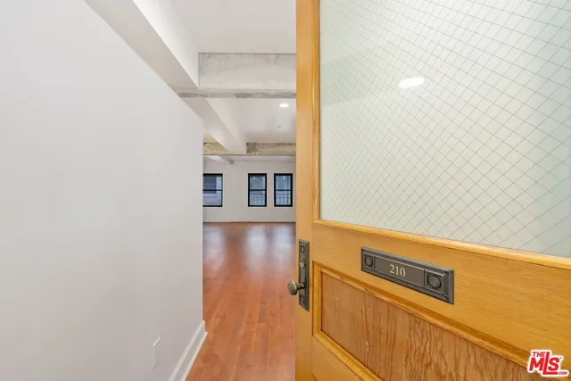 a living room with furniture and a lamp