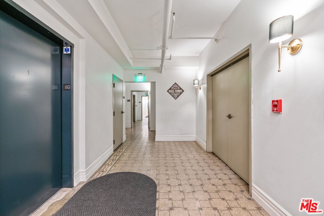 416 South Spring Street, Unit 210 Los Angeles, CA 90013 - Photo 15 of 18 a view of a hallway view with staircase