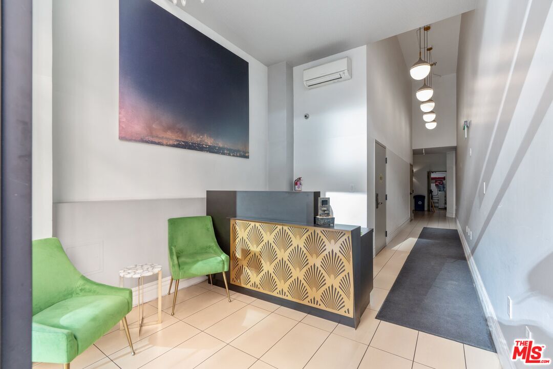416 South Spring Street, Unit 210 Los Angeles, CA 90013 - Photo 16 of 18 a living room with furniture