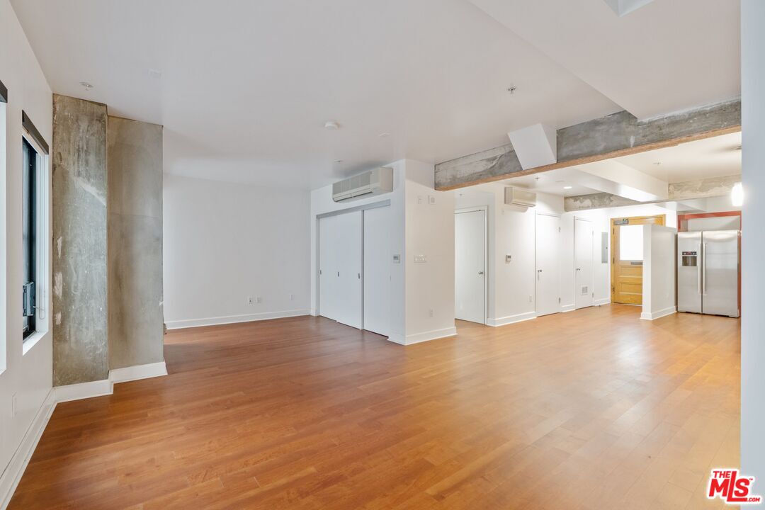 416 South Spring Street, Unit 210 Los Angeles, CA 90013 - Photo 2 of 18 a view of an empty room with closet area