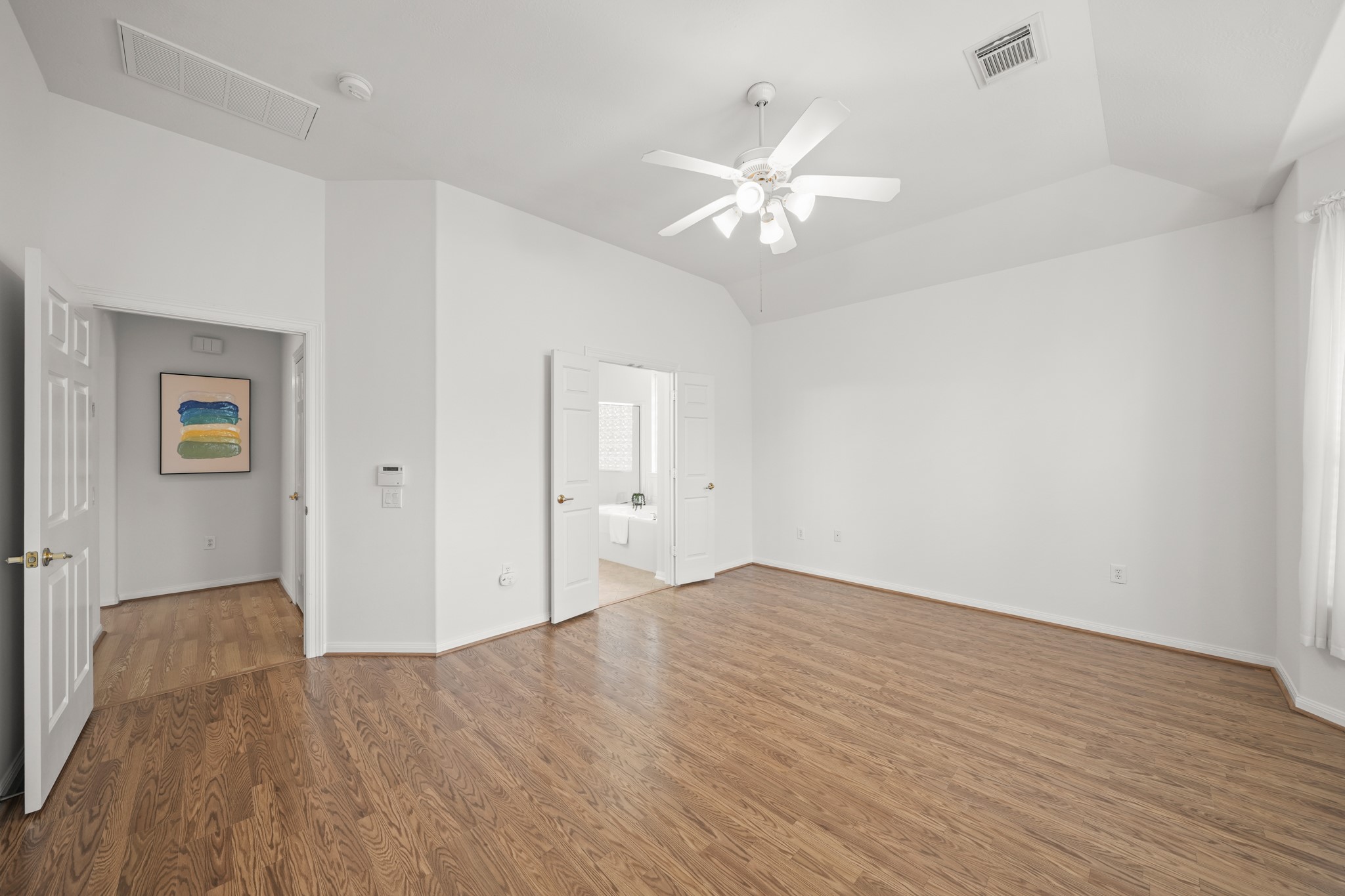 25003 Spring Ash Lane Katy, TX 77494 - Photo 21 of 43 The primary suite seamlessly transitions to a tranquil bath, creating the perfect retreat for unwinding at day's end.