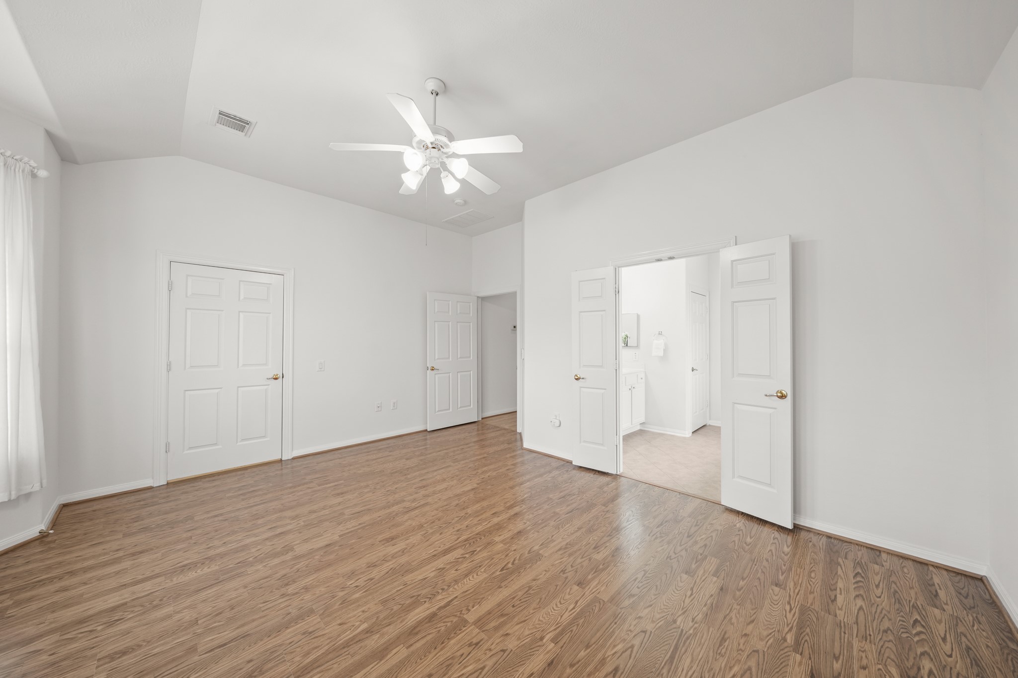 25003 Spring Ash Lane Katy, TX 77494 - Photo 22 of 43 This spacious primary suite invites you to create your own cozy sitting area, perfect for relaxation and comfort. There is plenty of room for a sitting area.