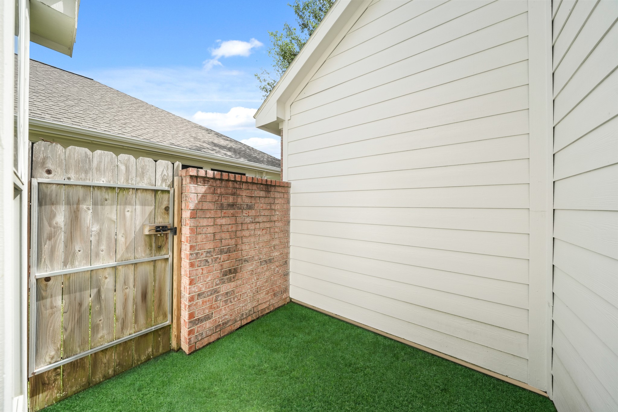 25003 Spring Ash Lane Katy, TX 77494 - Photo 29 of 43 A tranquil oasis with a private Astroturf patio extending from the secondary bedroom is perfect for yoga, light exercise, or unwinding outdoors and soaking in the fresh air.