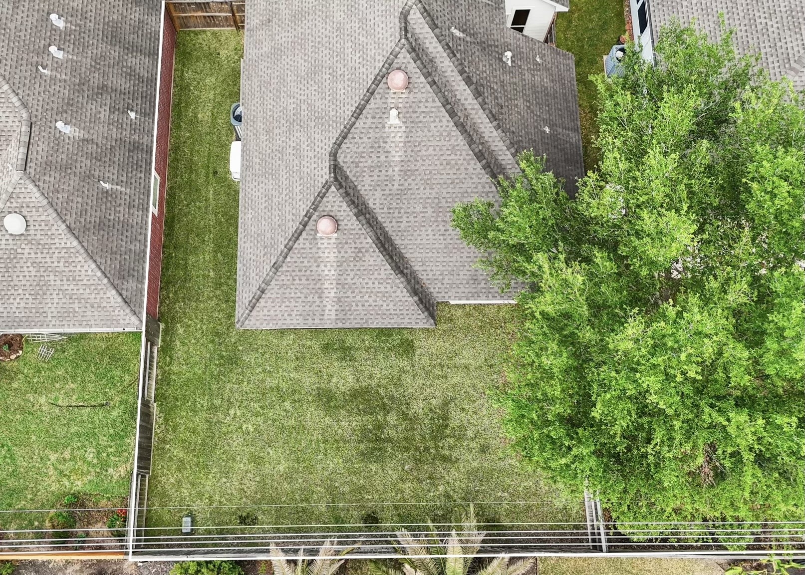 25003 Spring Ash Lane Katy, TX 77494 - Photo 33 of 43 This captivating aerial view showcases the expansive backyard, offering a glimpse of the full potential of your outdoor haven.