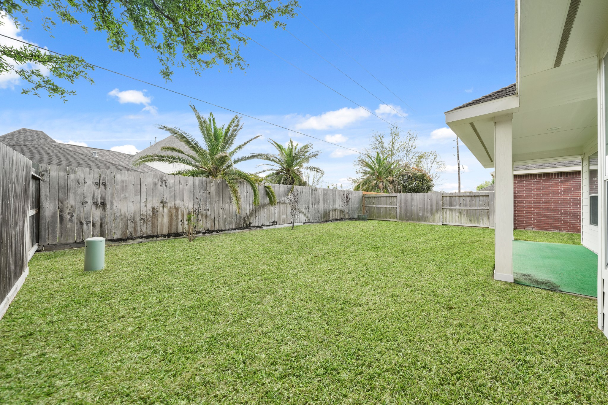 25003 Spring Ash Lane Katy, TX 77494 - Photo 36 of 43 A fully fenced backyard offers peace of mind with a secure, expansive lawn perfect for kids and pets to play freely and safely in a private setting.