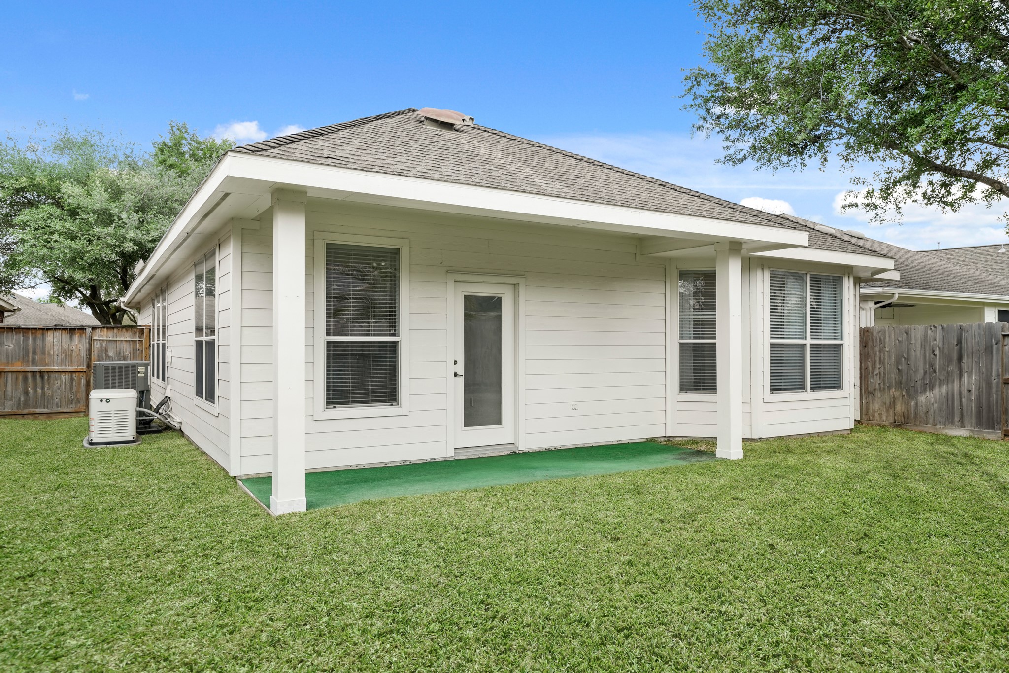 25003 Spring Ash Lane Katy, TX 77494 - Photo 38 of 43 Thisbackyard has plenty of space with a large sideyard with access to the front yard. Here is afull shot of the covered back patio.