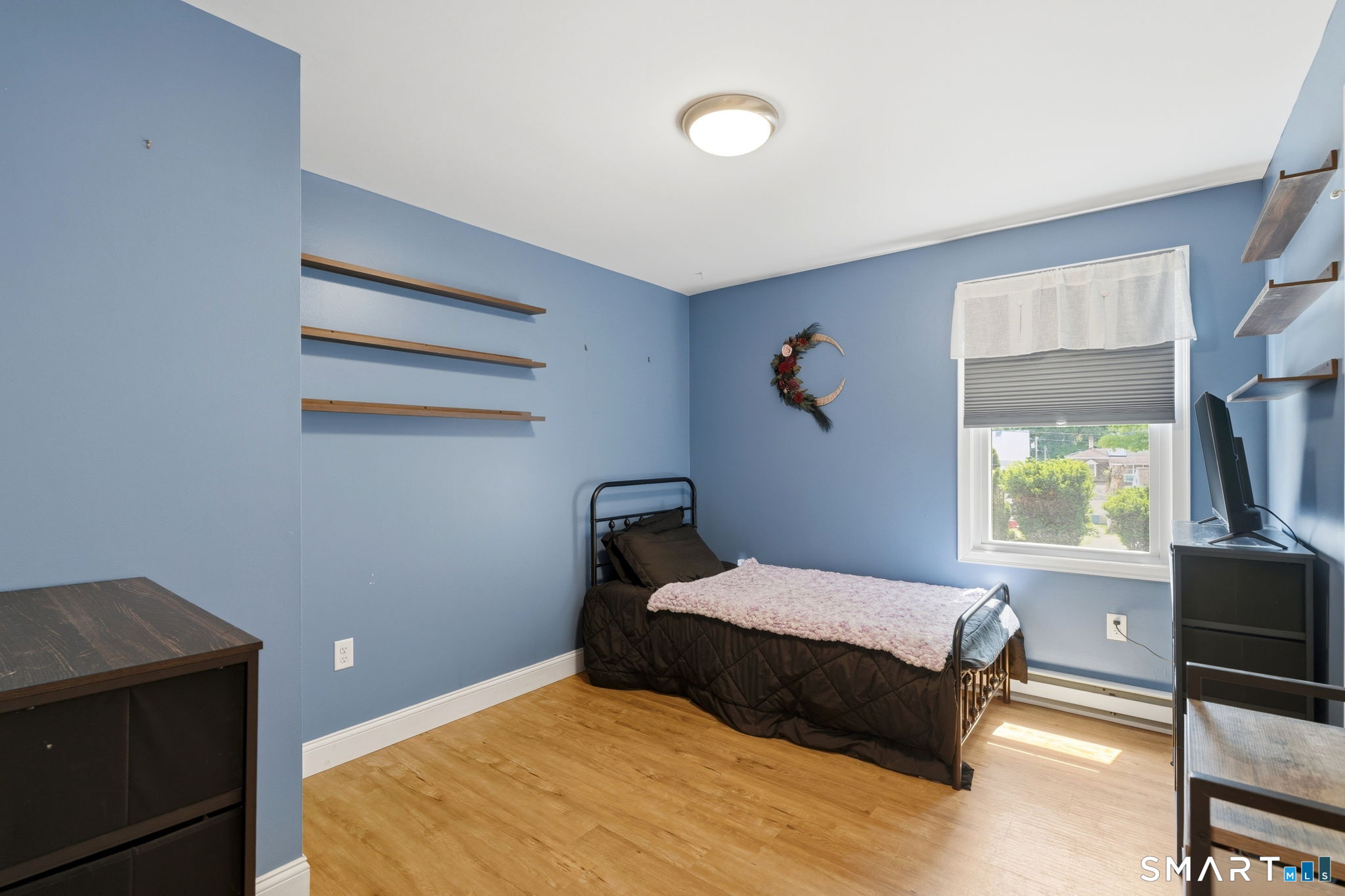 71 Smith Street Putnam, CT 06260 - Photo 8 of 25 a bedroom with a bed and window