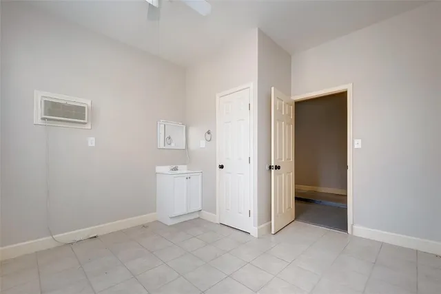 an empty room with closet area