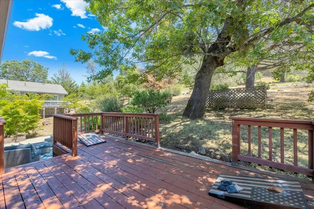 a bedroom with two beds and a chandelier