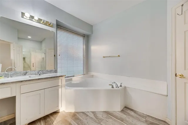 a bathroom with a bathtub and a sink
