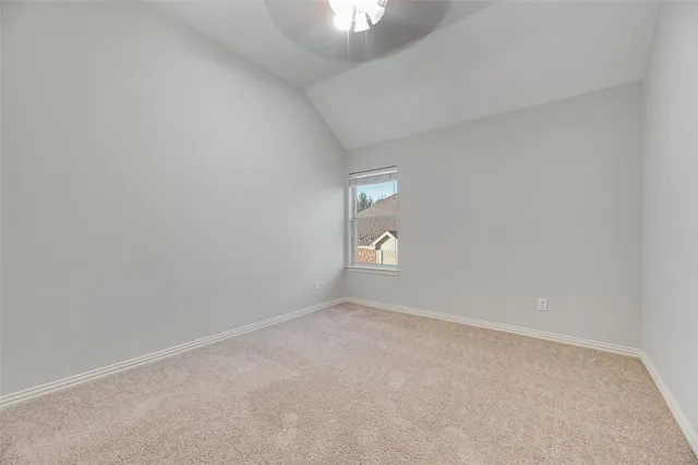 a view of an empty room and a window