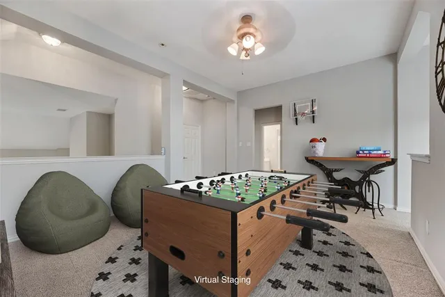 a living room with furniture and a dining table