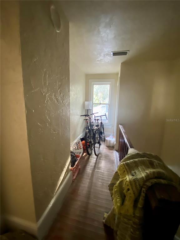 1102 Northwest 3rd Avenue Gainesville, FL 32601 - Photo 14 of 23 a bed sitting in a bedroom next to a window