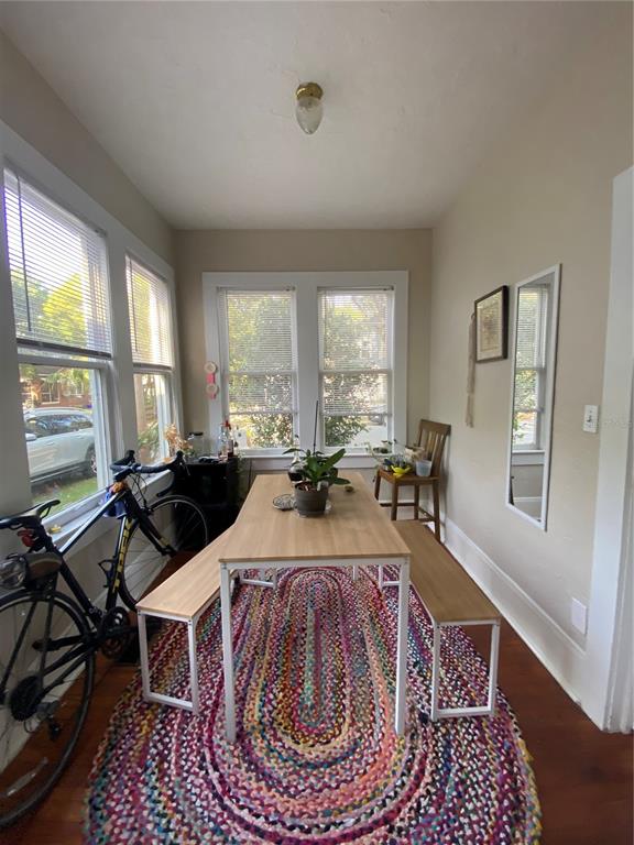 1102 Northwest 3rd Avenue Gainesville, FL 32601 - Photo 23 of 23 a living room with furniture a rug and a large window