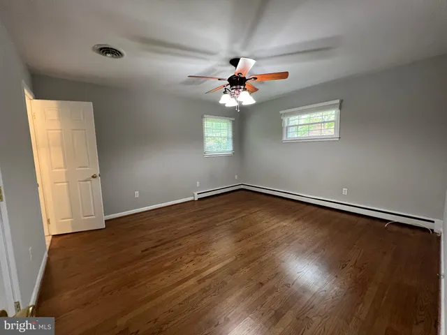a view of room with window and ceiling fan