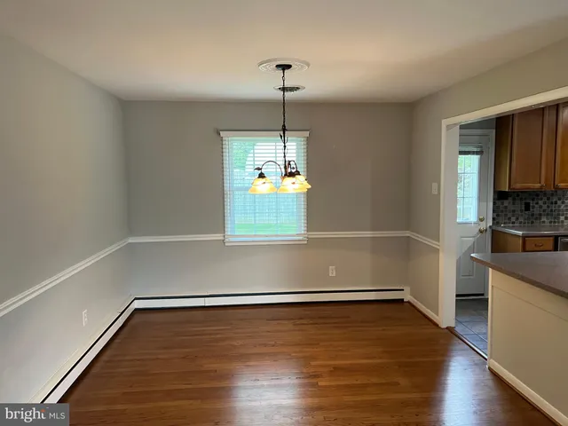 a view of entryway with wooden floor