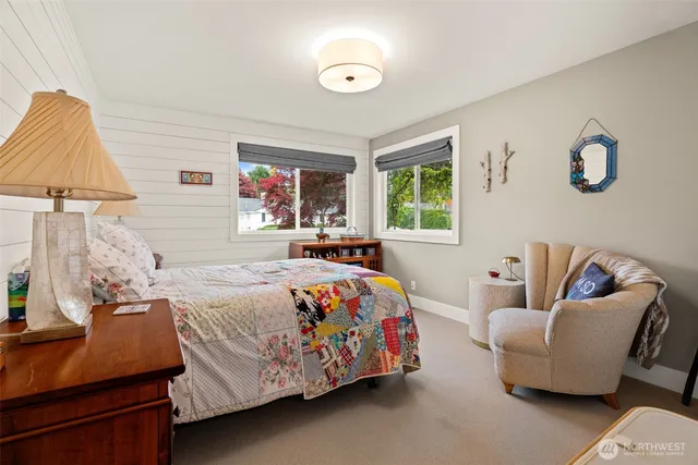 a bedroom with a bed and a couch