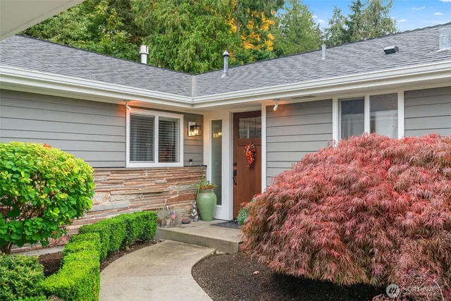 a view of house with backyard