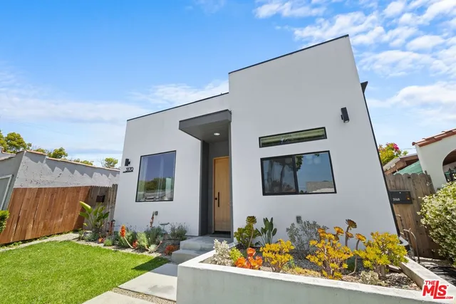 an aerial view of a house with a garden
