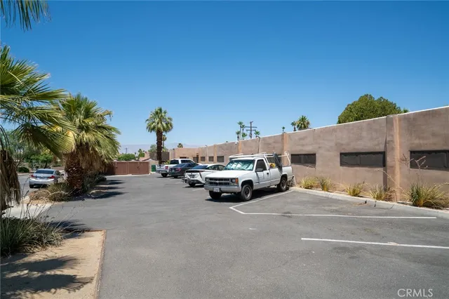 a view of car parked in front of a building
