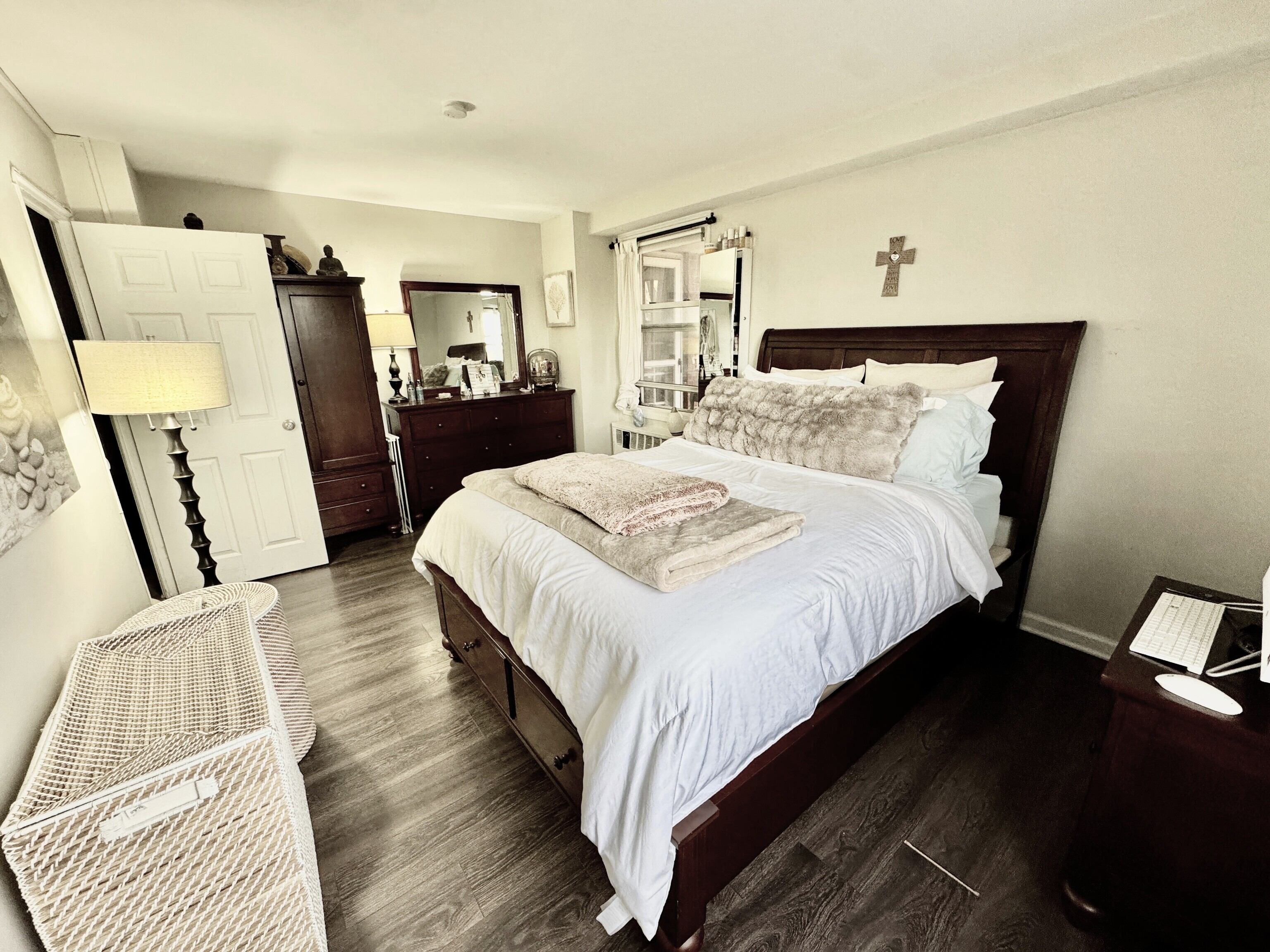 71 Strawberry Hill Avenue, Unit 421 Stamford, CT 06902 - Photo 17 of 31 a bedroom with a bed a mirror with wooden floor