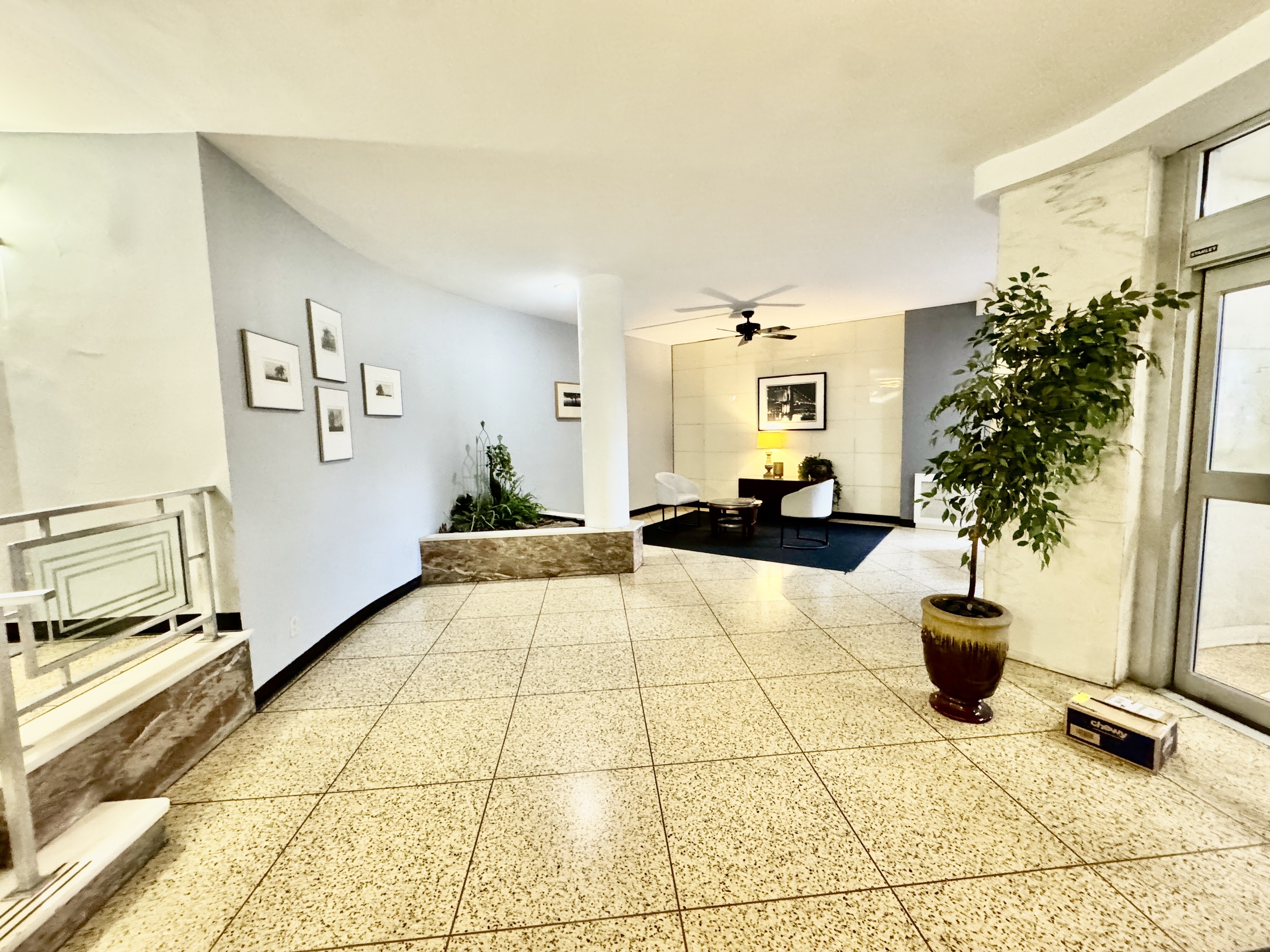 71 Strawberry Hill Avenue, Unit 421 Stamford, CT 06902 - Photo 4 of 31 a lobby with furniture and potted plant