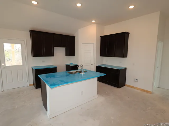 a kitchen with a stove and a microwave