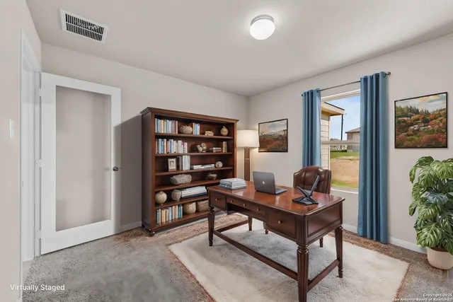 a view of a workspace with furniture