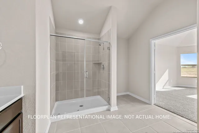 a bathroom with a shower and a tub