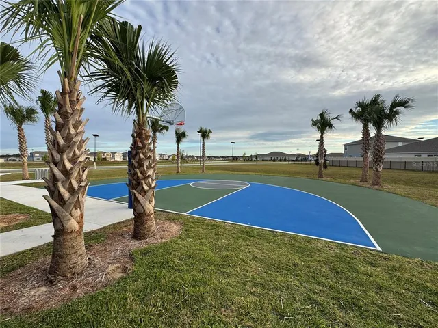a kitchen with stainless steel appliances granite countertop a refrigerator stove and sink