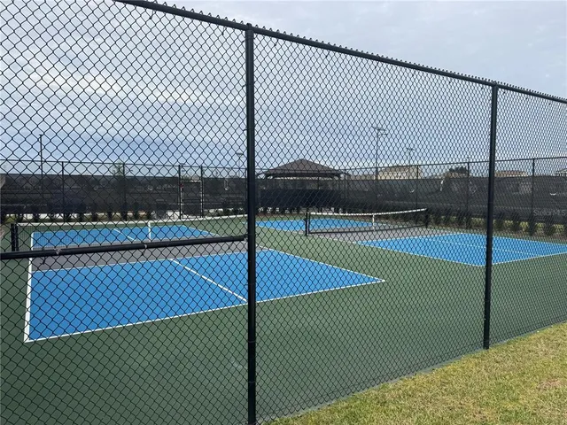 a view of a two chairs under an umbrella