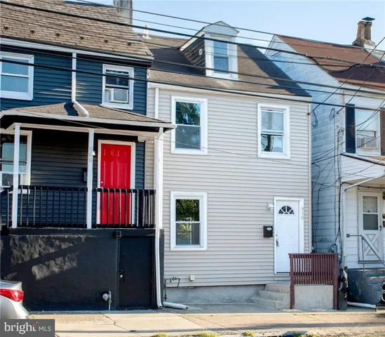 a front view of a house with a garage