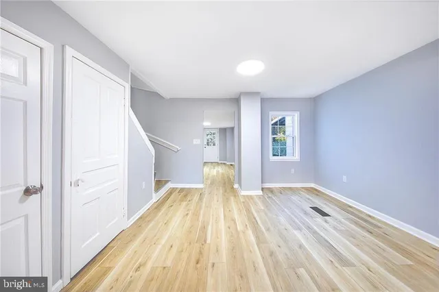 a view of a room with wooden floor and balcony