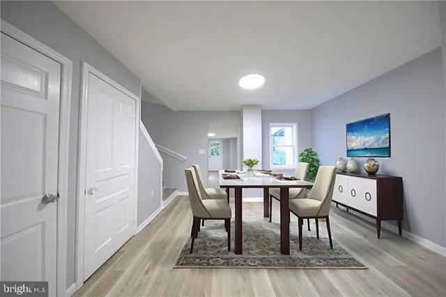 a dining room with furniture and window