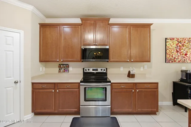 a kitchen with a stove and a microwave