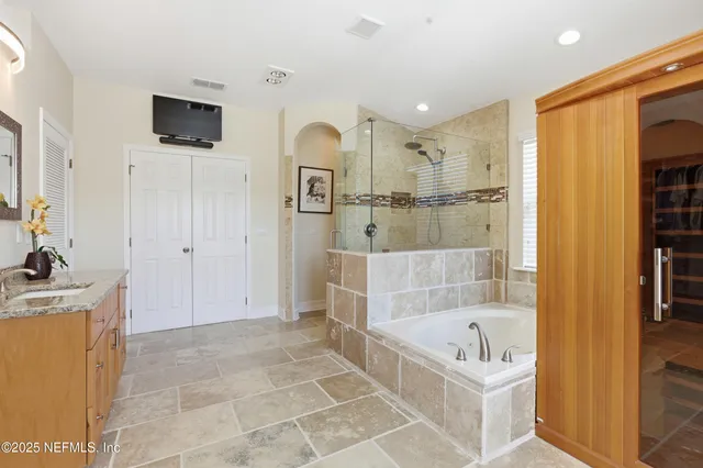 a bathroom with a bathtub and a shower