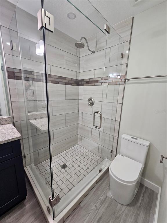 7043 Brentford Road Sarasota, FL 34241 - Photo 12 of 19 a bathroom with a toilet and a shower