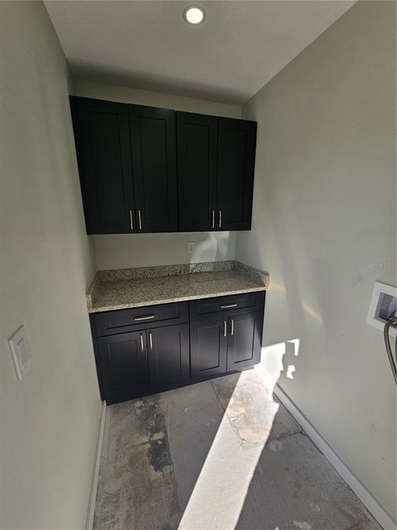 7043 Brentford Road Sarasota, FL 34241 - Photo 17 of 19 a living room with a sink and cabinets