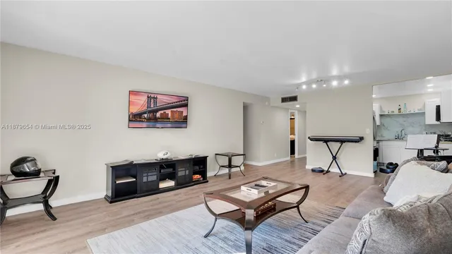 a kitchen with stainless steel appliances granite countertop a refrigerator sink and stove