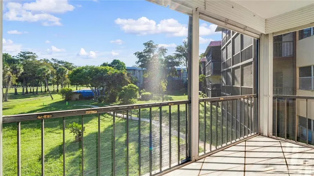 a view of a park with large trees