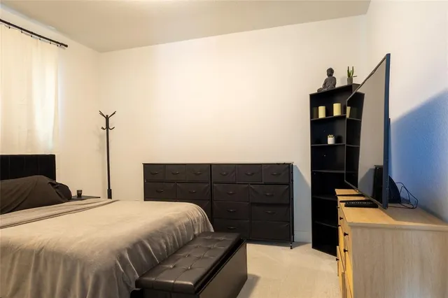 a bedroom with a bed and a walk in closet