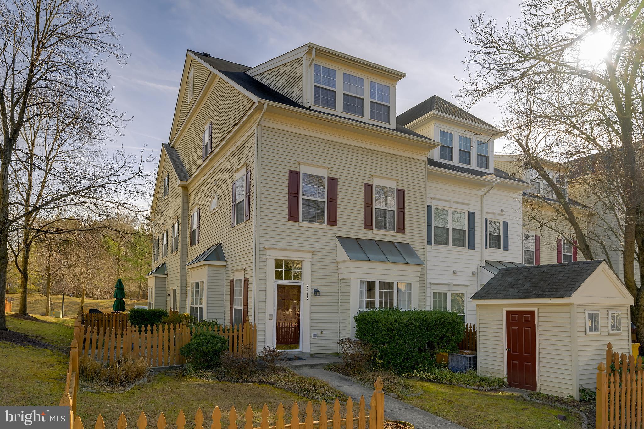 a view of a white house with a large windows